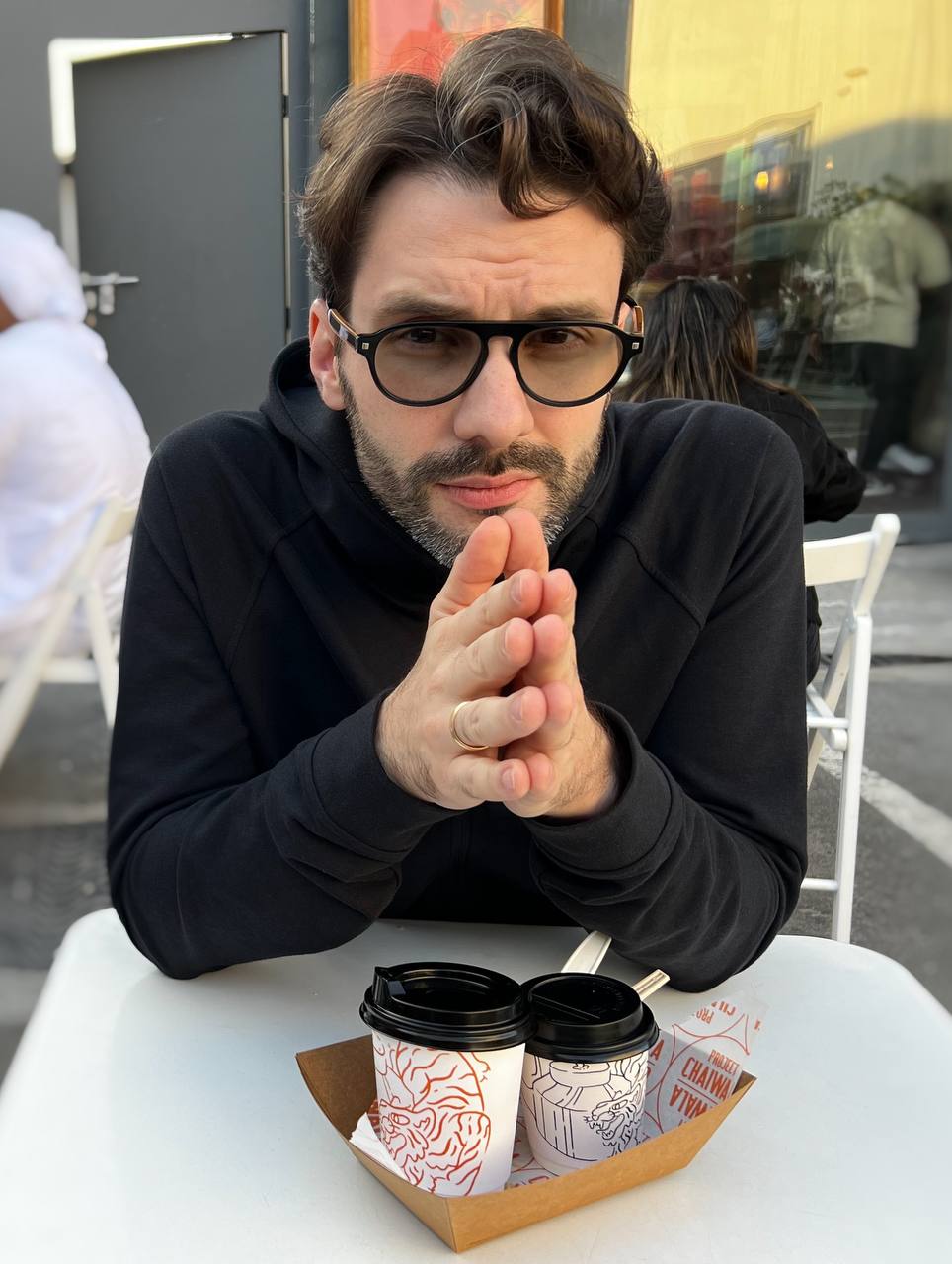 The poet Mike Ravdonikas photographed outside a cinema in the Alserkal Avenue cultural district of Dubai.